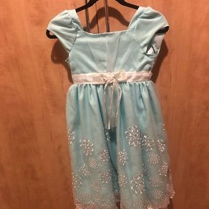 Sky blue dress with solid inlay.